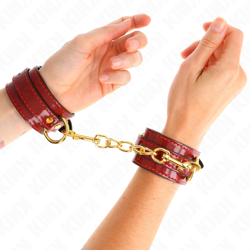KINK - MUÑEQUERAS JOANNA ANGEL ROJO AJUSTABLE CON CADENA DORADO 16.5-26 CM X 4 CM - BDSM & BONDAGE - El Arte del Pl…